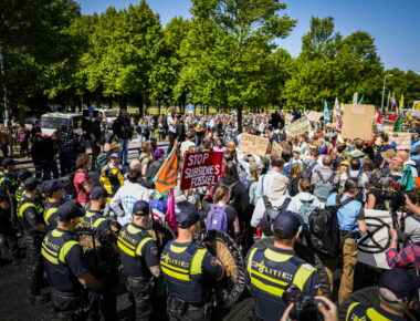 epa10657041 Activists of Extinction Rebellion are stopped by the police during a demonstration to block the A12 for the seventh time, in The Hague, the Netherlands, 27 May 2023. With the action, Extinction Rebellion wants to make the Dutch government know it opposes fossil subsidies. During the most recent blockade on 11 March some 700 activists were arrested.  EPA/Sem van der Wal