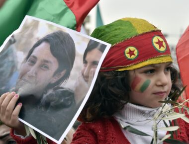 epa06498178 A Kurdish girl carries a picture of late 23-year-old Kurdish People's Protection Units (YPJ) fighter Barin Kobani, during a protest against what they call the 'Turkish aggression' in northern Syria, near the US embassy in Awkar, east of Beirut, Lebanon, 05 February 2018. The Turkish army is on an operation named 'Operation Olive Branch' in Syria's northern regions against the Kurdish Popular Protection Units (YPG) forces which control the city of Afrin. Turkey classifies the YPG as a terrorist organization.  EPA/WAEL HAMZEH