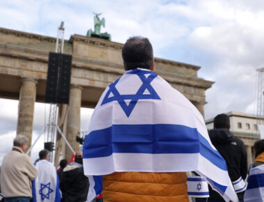 BERLIN, GERMANY - OCTOBER 22: People, including some draped in Israeli flags, attend a demonstration to show solidarity with Israel and against anti-semitism on October 22, 2023 in Berlin, Germany. Thousands of people attended the event in front of the Brandenburg Gate as the conflict between Hamas and Israel continues to range following the deadly October 7 incursions by Hamas fighters from Gaza into Israel.  (Photo by Sean Gallup/Getty Images)