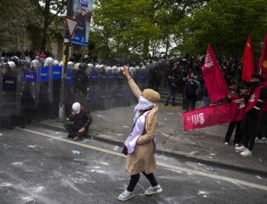 Union members clash with Turkish anti riot police officers as they march during Labor Day celebrations in Istanbul, Turkey, Wednesday, May 1, 2024. Police in Istanbul used tear gas and fired rubber bullets to disperse thousands of people attempting to break through a barricade and reach the city's main square, Taksim, in defiance of a government ban on celebrating May 1 Labor Day at the landmark location. (AP Photo/Khalil Hamra)