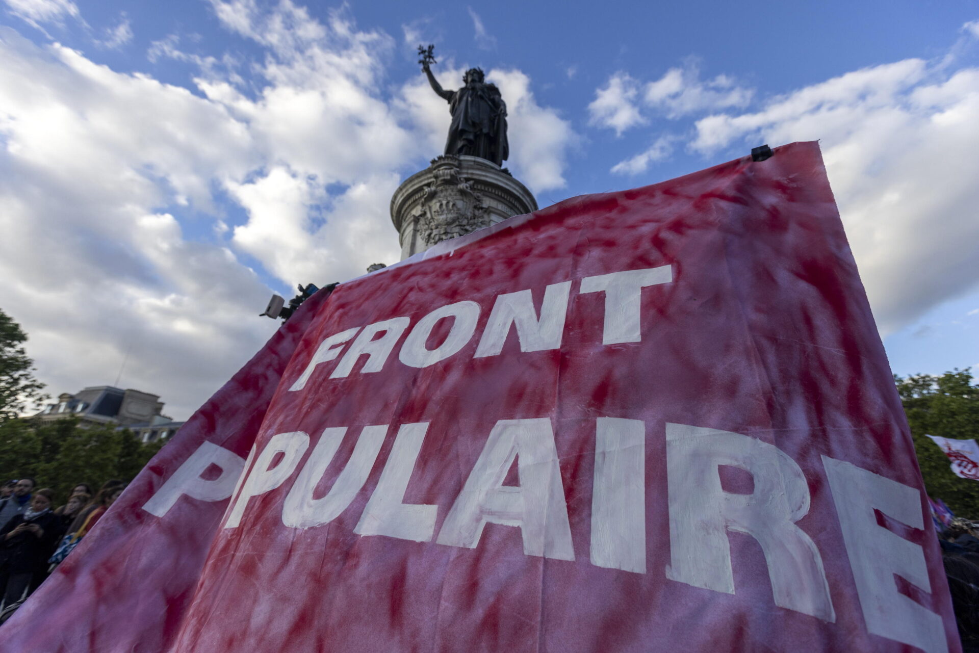 epa11402957 A giant banner reading in French Popular Front is displayed during a protest against the French right-wing party National Rally (Rassemblement National or RN) following the results of the European elections, in Paris, France, 10 June 2024. Unions CGT and Left Party called for national protests after the National Rally made significant gains in the European Union parliamentary elections. The European Parliament elections took place across EU member states from 06 to 09 June 2024.  EPA/ANDRE PAIN