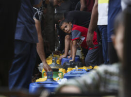 Palestinians arrive to collect drinking water during the ongoing Israeli bombardment of the Gaza Strip in Rafah on Saturday, Oct. 28, 2023. (AP Photo/Hatem Ali)